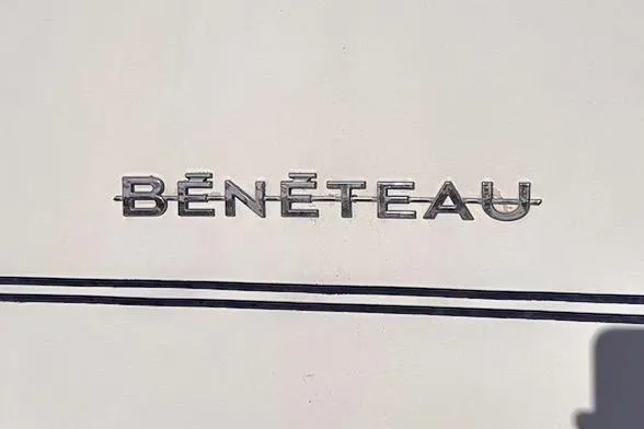 Slide: The Image of Beneteau 343 2006 logo on boat hull, featuring sleek metallic lettering. - 13