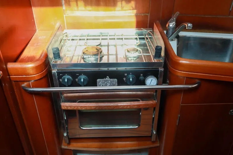 Slide: The Image of Galley kitchen in 2006 Beneteau 343 sailboat with stove and sink. - 19