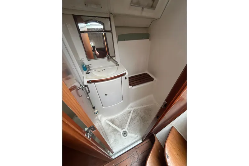Slide: The Image of Bathroom interior of 2006 Beneteau 343 sailboat with sink and shower. - 2