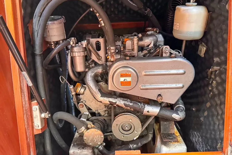 Slide: The Image of Engine compartment of a 2006 Beneteau 343 sailboat, showcasing mechanical components. - 27