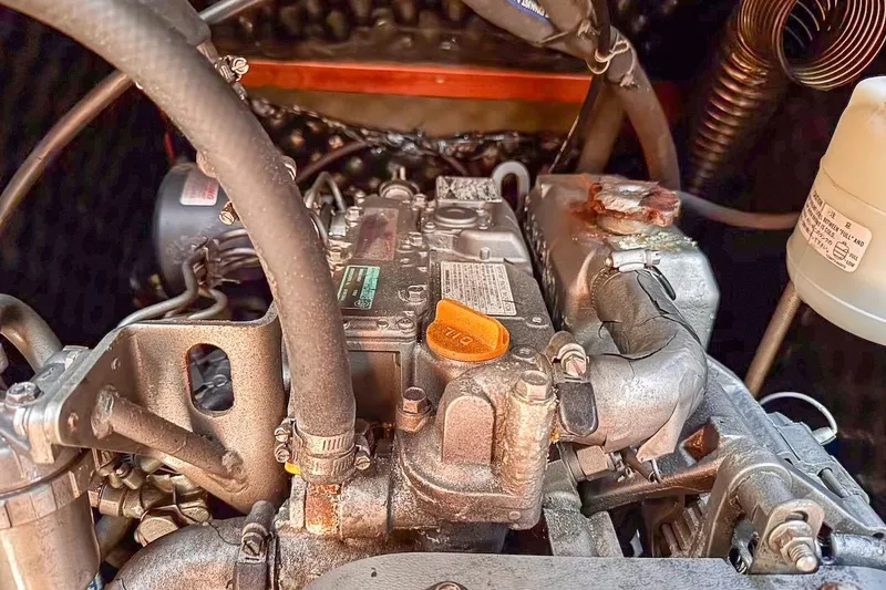 Slide: The Image of Engine compartment of a 2006 Beneteau 343 sailboat, showcasing mechanical components. - 28