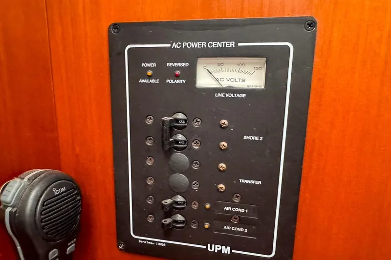 Slide: The Image of AC power center panel on 2006 Beneteau 343 sailboat, featuring voltage meter and controls. - 30