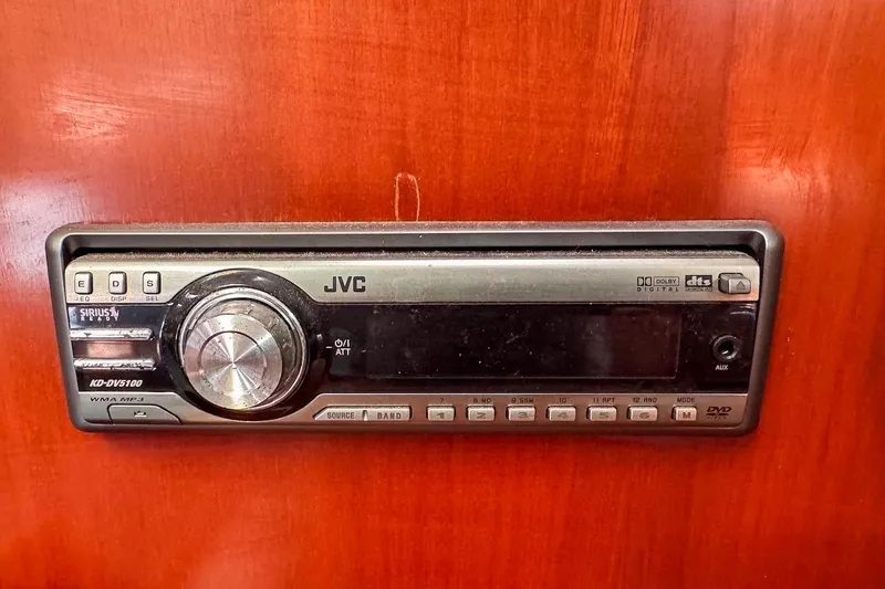Slide: The Image of JVC stereo system in 2006 Beneteau 343 yacht, mounted on wooden panel. - 32