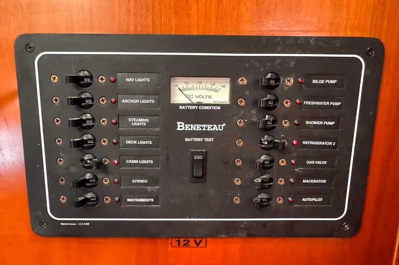 Slide: The Image of Electrical control panel on a 2006 Beneteau 343 sailboat, featuring various switches and a voltmeter. - 33