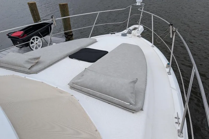 Slide: The Image of 2003 Carver 356 Motor Yacht deck with cushions and docked cart. - 8