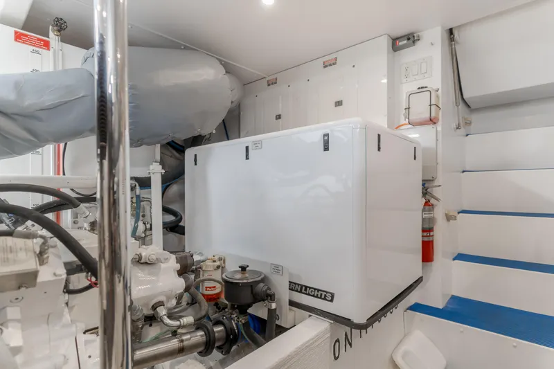Slide: The Image of Engine room of 2006 West Bay 64 yacht with generator and equipment. - 18