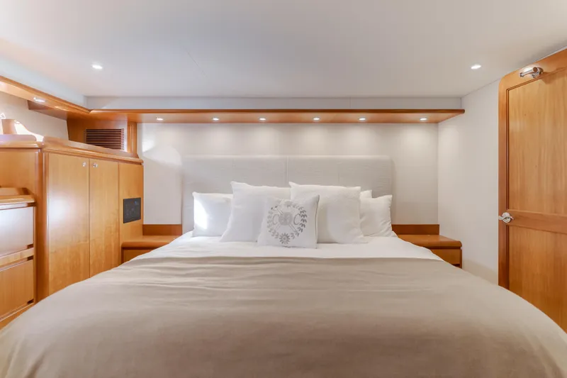 Slide: The Image of Luxurious bedroom interior of 2006 West Bay 64 yacht with elegant wood finishes. - 20