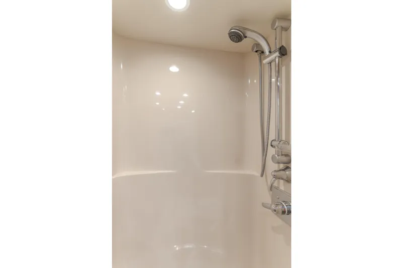 Slide: The Image of Luxurious shower in 2006 West Bay 64 yacht, featuring modern fixtures and lighting. - 25