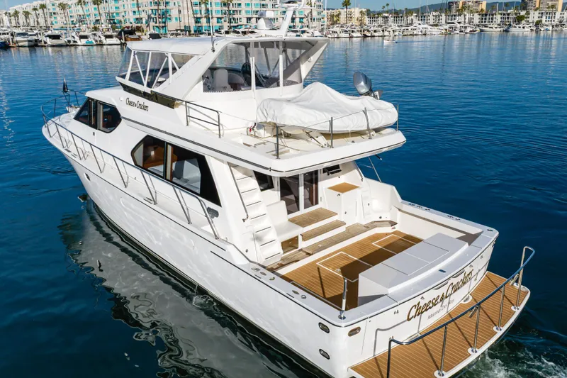 Slide: The Image of Luxury 2006 West Bay 64 yacht cruising in marina with modern design and spacious deck. - 4