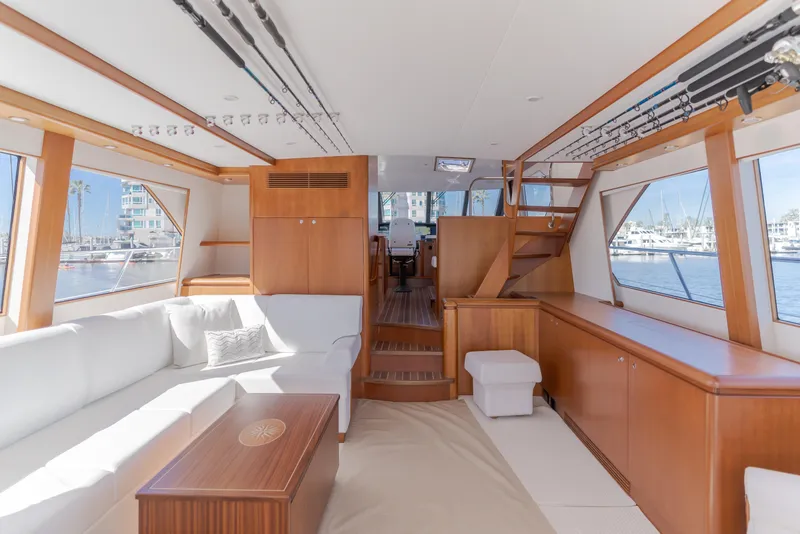 Slide: The Image of Luxurious 2006 West Bay 64 yacht interior with elegant wood finishes and spacious seating. - 45