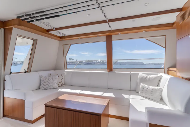 Slide: The Image of Luxurious interior of 2006 West Bay 64 yacht with white seating and ocean view. - 46