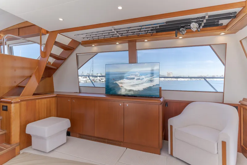 Slide: The Image of Luxurious interior of 2006 West Bay 64 yacht with modern furnishings and scenic window view. - 48