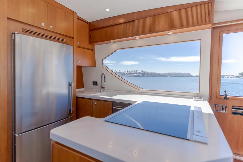 Slide: The Image of Luxurious kitchen interior of 2006 West Bay 64 yacht with ocean view. - 51