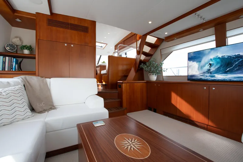 Slide: The Image of Luxurious interior of 2006 West Bay 64 yacht with elegant wood finishes and modern decor. - 56