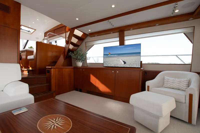 Slide: The Image of Luxurious 2006 West Bay 64 yacht interior with elegant wood finishes and modern amenities. - 57
