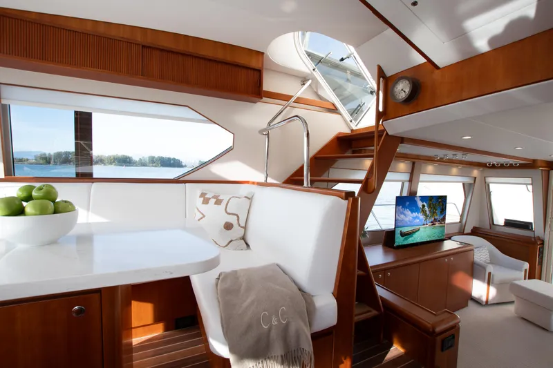 Slide: The Image of Luxurious interior of 2006 West Bay 64 yacht with elegant wood finishes and scenic views. - 59