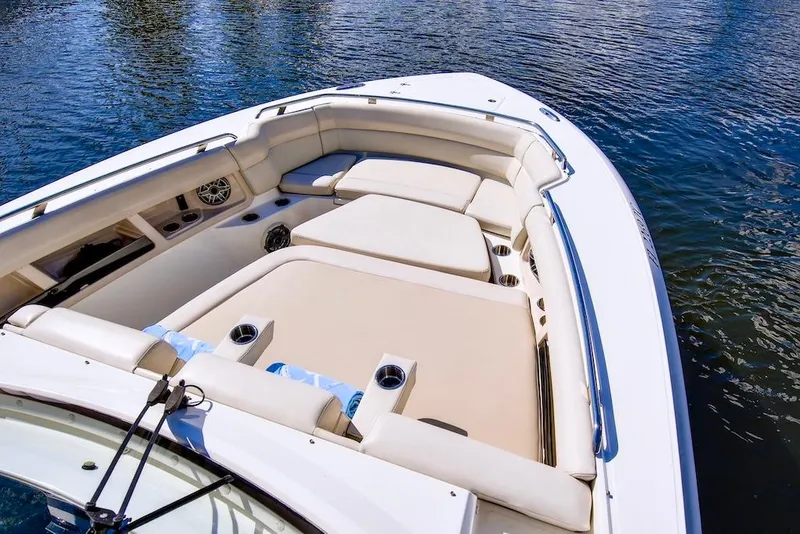 Slide: The Image of 2019 Boston Whaler 350 Realm boat with spacious seating on calm water. - 13