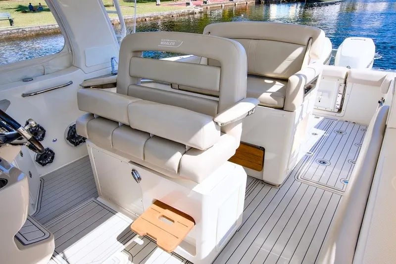 Slide: The Image of 2019 Boston Whaler 350 Realm interior with luxurious seating and sleek design. - 14
