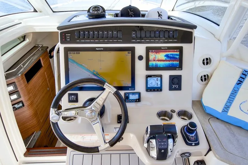 Slide: The Image of 2019 Boston Whaler 350 Realm helm with advanced navigation and control systems. - 16