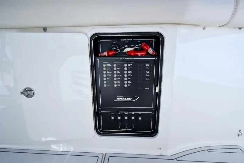 Slide: The Image of Control panel of 2019 Boston Whaler 350 Realm boat, featuring switches and indicators. - 30