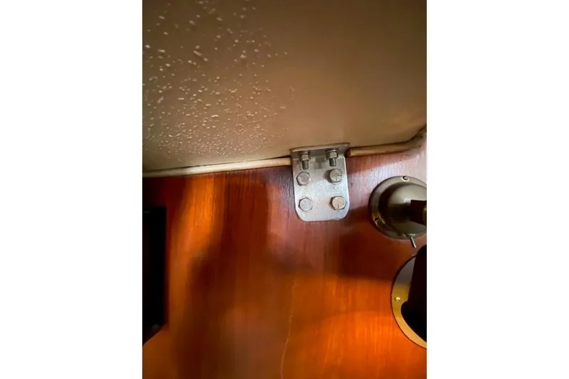 Slide: The Image of Interior detail of a 1979 Morgan 321, featuring a metal bracket on wood paneling. - 19