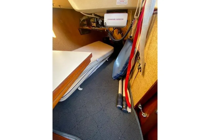 Slide: The Image of 1979 Morgan 321 boat interior with radio equipment and storage area. - 21