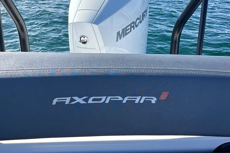 Slide: The Image of Axopar 22 Spyder 2021 boat with Mercury engine on water. - 23