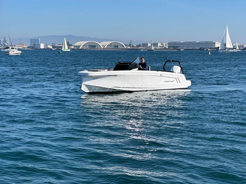 Slide: The Image of 2021 Axopar 22 Spyder boat cruising on a sunny day in open water. - 7
