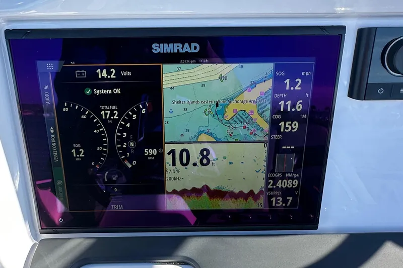 Slide: The Image of Simrad navigation display on 2021 Axopar 22 Spyder showing speed, depth, and map. - 9