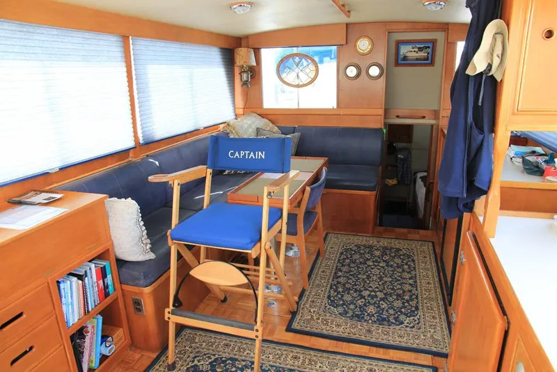 Slide: The Image of Interior of 1974 Grand Banks 42 Motoryacht with captain's chair and nautical decor. - 18