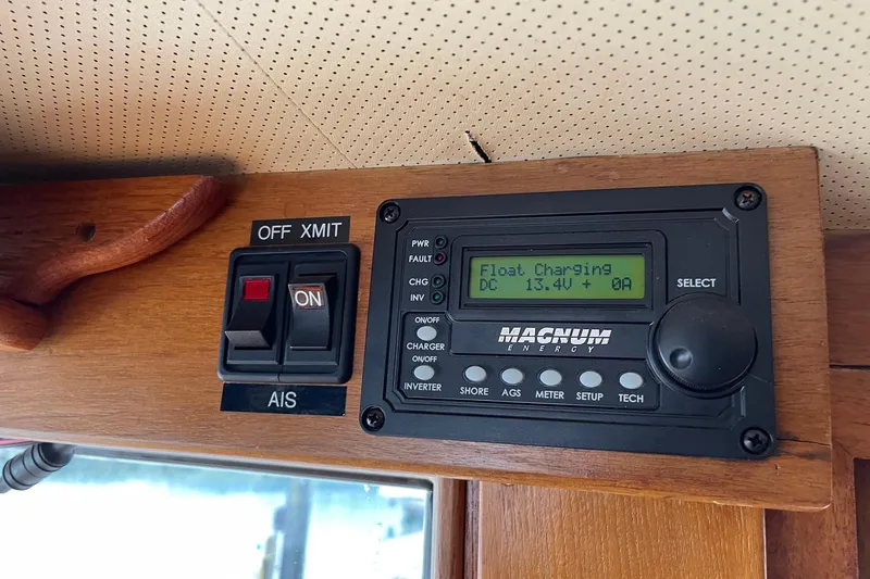 Slide: The Image of Control panel on 1974 Grand Banks 42 Motoryacht displaying Magnum Energy settings. - 29