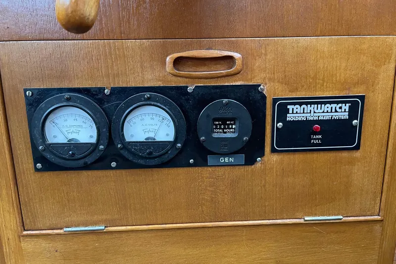 Slide: The Image of Control panel of a 1974 Grand Banks 42 Motoryacht with gauges and TankWatch alert system. - 33