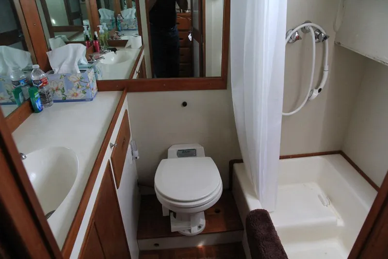 Slide: The Image of Bathroom interior of 1974 Grand Banks 42 Motoryacht with shower, toilet, and sink. - 34