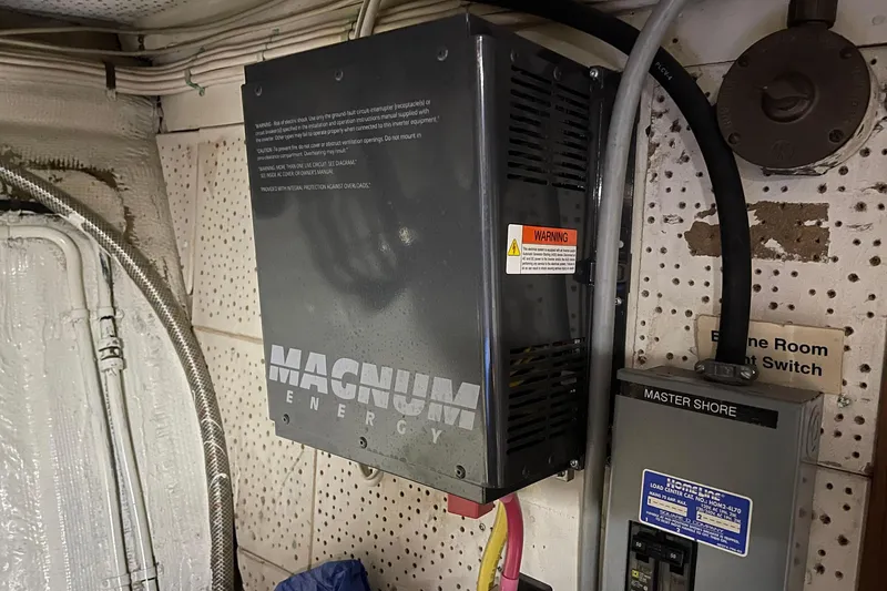 Slide: The Image of Electrical panel and Magnum Energy inverter in 1974 Grand Banks 42 Motoryacht engine room. - 46