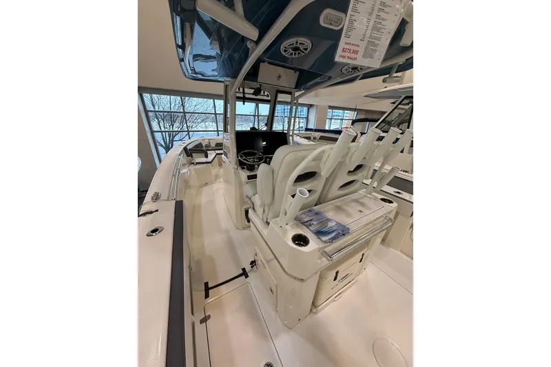 Slide: The Image of 2026 Cobia 285 Center Console boat interior with helm and seating area. - 3