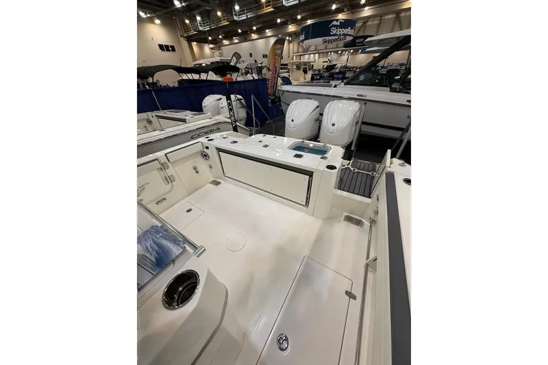 Slide: The Image of 2026 Cobia 285 Center Console boat interior at a boat show. - 6