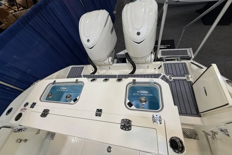 Slide: The Image of Cobia 285 Center Console 2026 with dual engines and storage. - 17