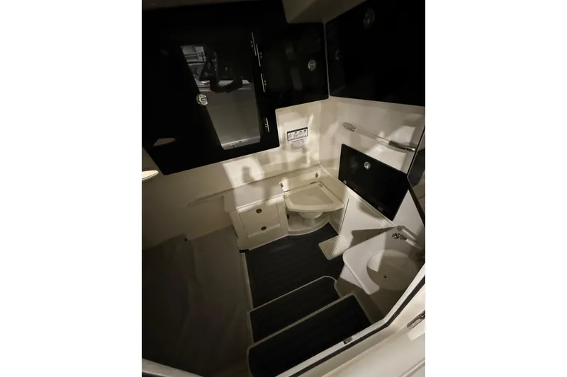 Slide: The Image of 2026 Cobia 350 Center Console interior cabin with modern amenities and sleek design. - 13