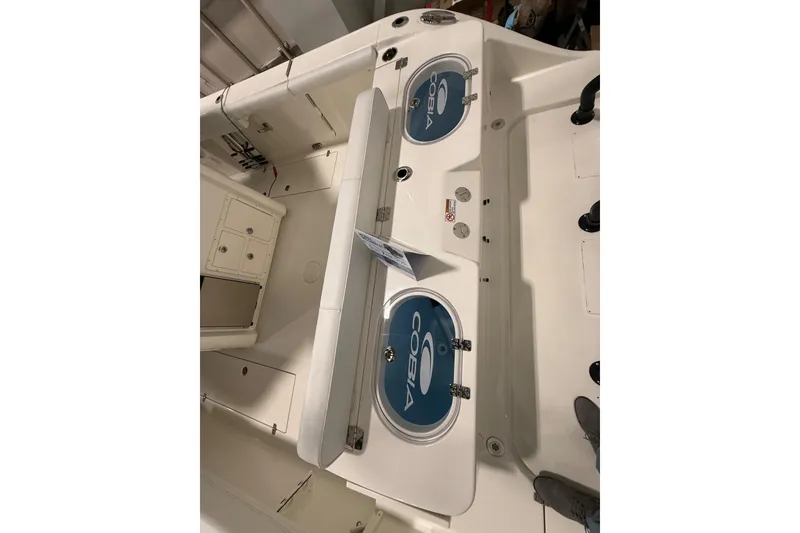 Slide: The Image of 2026 Cobia 350 Center Console boat interior with storage compartments. - 16
