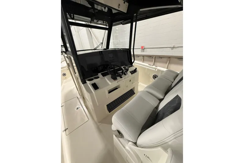 Slide: The Image of 2026 Cobia 350 Center Console interior with modern helm and seating. - 18
