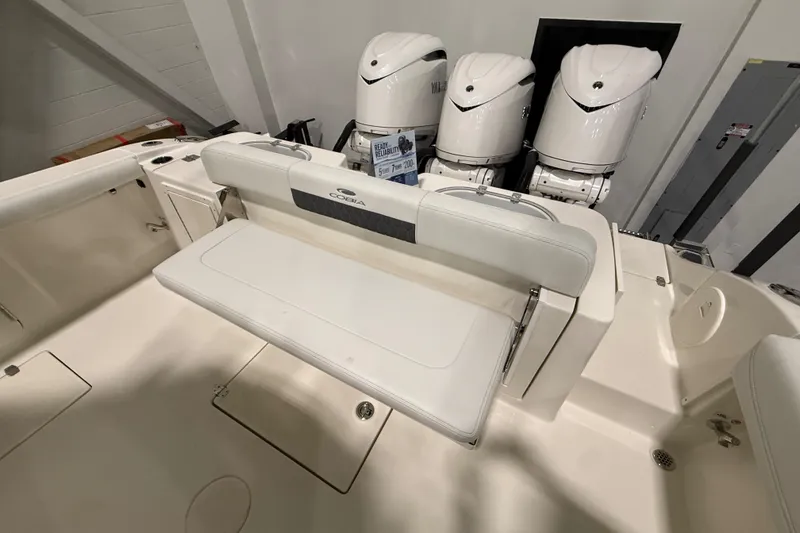 Slide: The Image of 2026 Cobia 350 Center Console boat with triple outboard engines and foldable seating. - 20