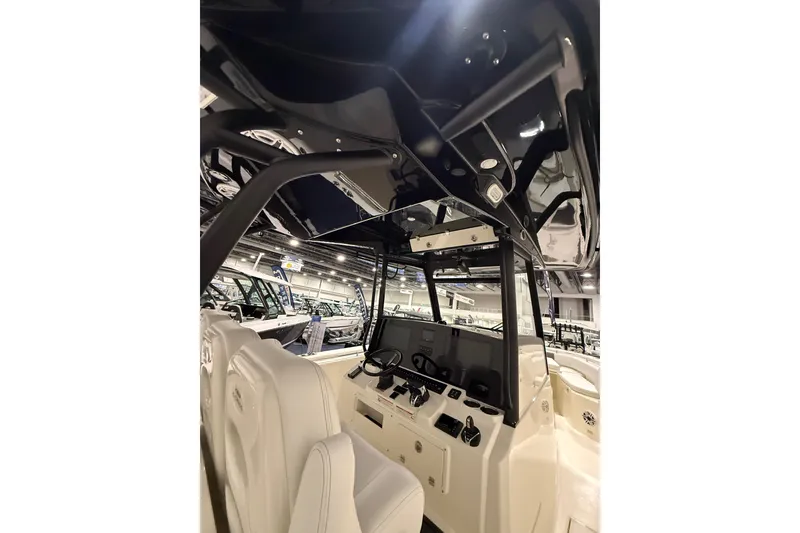 Slide: The Image of 2026 Cobia 350 Center Console interior with modern dashboard and seating. - 23
