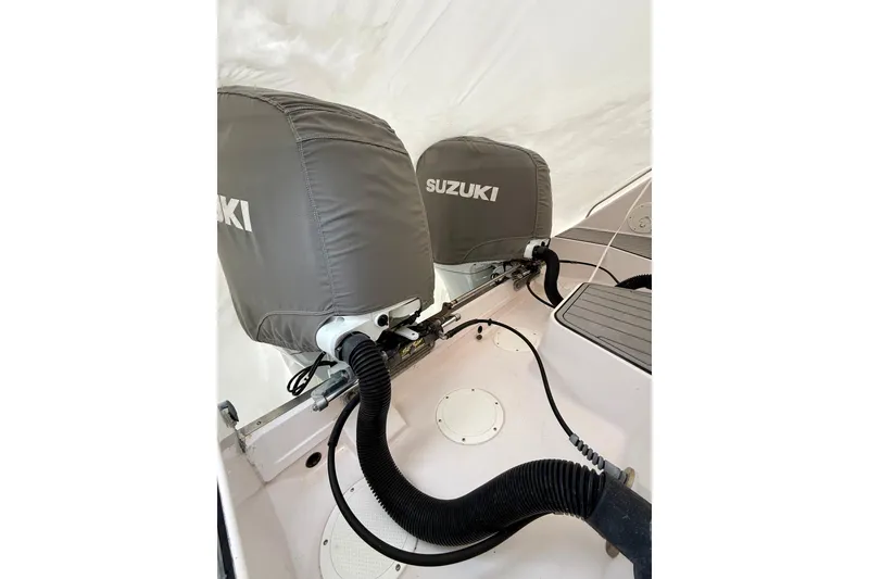 Slide: The Image of 2002 Grady-White Express 330 boat with Suzuki outboard motors covered. - 17