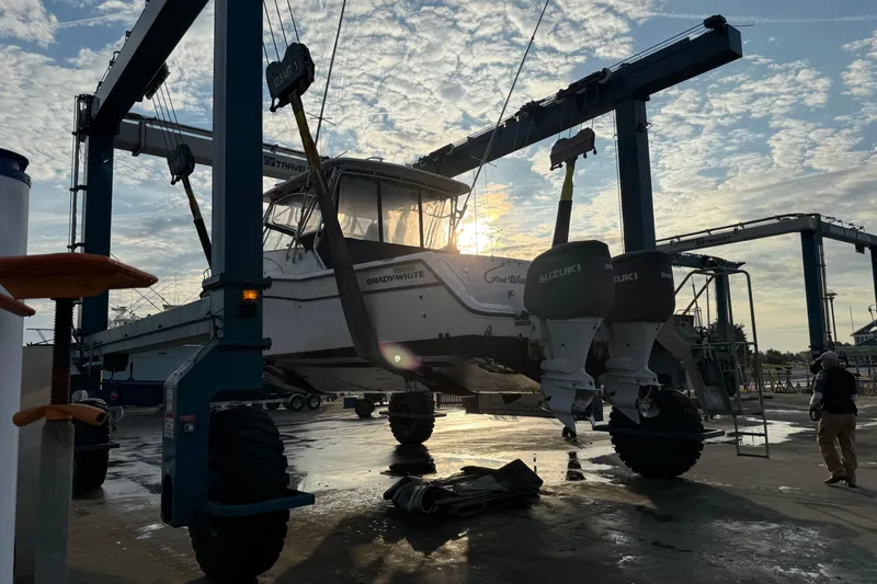 Slide: The Image of 2002 Grady-White Express 330 boat cockpit with modern navigation equipment and comfortable seating. - 6