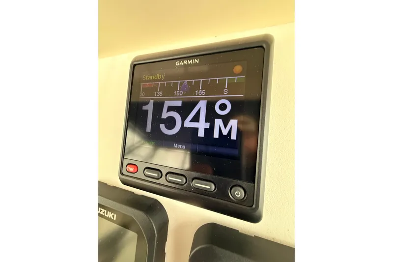 Slide: The Image of Garmin display on 2002 Grady-White Express 330 showing 154 degrees heading. - 9