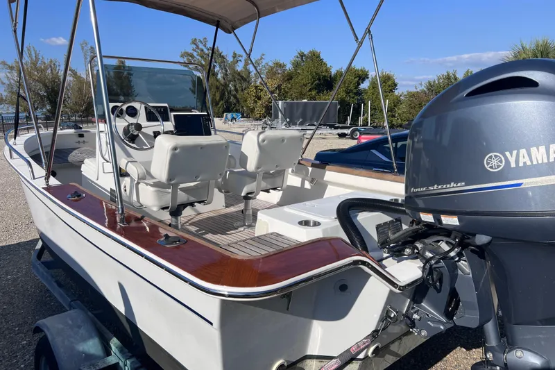 Slide: The Image of 1998 Cape Horn 23 Cape Bay boat with Yamaha outboard motor, parked on a trailer. - 10