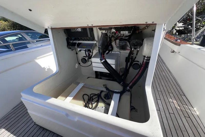 Slide: The Image of Open engine compartment of 1998 Cape Horn 23 Cape Bay boat, showing wiring and components. - 20