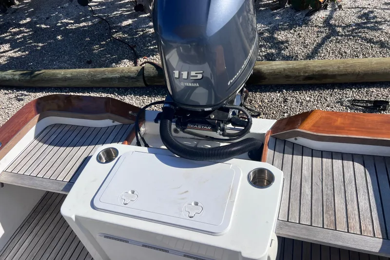 Slide: The Image of 1998 Cape Horn 23 Cape Bay boat with Yamaha 115 outboard motor, wooden deck details. - 25