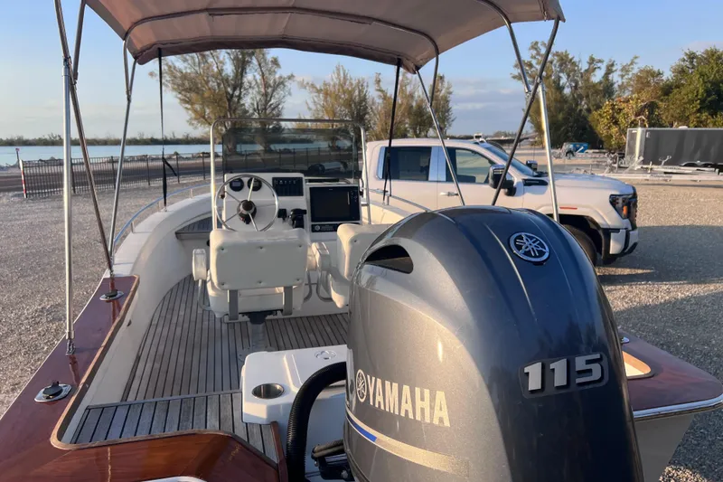 Slide: The Image of 1998 Cape Horn 23 Cape Bay boat with Yamaha 115 engine, parked near a truck. - 26