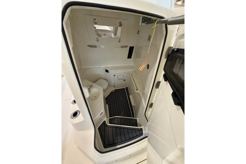 Slide: The Image of 2026 Cobia 305 Center Console interior with modern amenities and sleek design. - 15
